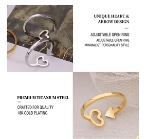 Detail of titanium steel heart and arrow adjustable rings in gold and silver plating