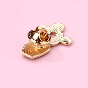 Macro shot of gold brooch back with S925 hallmark and butterfly clutch detail