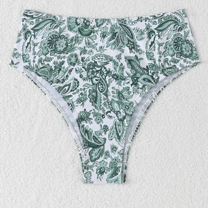 Detailed flat lay of high-waisted bikini bottoms with green paisley tropical leaf print