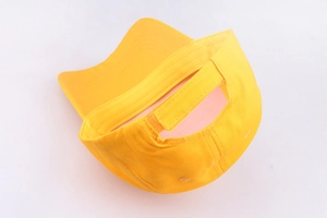 Detail of yellow cotton baseball cap featuring the adjustable hook and loop back strap
