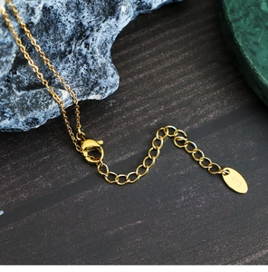 Detail of 18K gold plated necklace showing lobster clasp and K18 extension chain