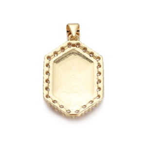Detail of gold hexagonal pendant with inlaid zircon and a polished smooth back