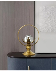 Close-up of a luxury lotus crystal ball with a golden metal leaf base for home decor