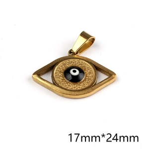 Detail showing 17mm by 24mm size of vintage golden diamond-shaped evil eye pendant