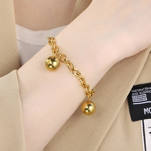 Detail of 18K gold-plated titanium steel chain bracelet with double polished beads