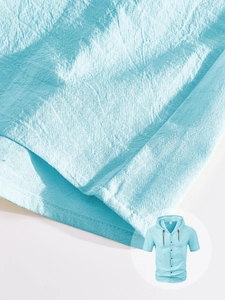 Macro detail of breathable light blue linen fabric texture on men's hooded short sleeve shirt