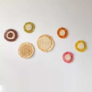 Detailed set of 7 colorful handmade woven straw wall decors with bohemian fringes