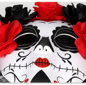 Close-up of Day of the Dead mask with floral roses and black painted details