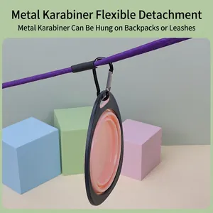 Pink portable folding pet bowl with metal carabiner for outdoor dog walking and feeding