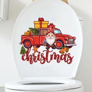 Detail of waterproof Christmas truck and Santa stickers applied on a white toilet lid