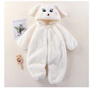 Close-up of baby white plush jumpsuit with cute rabbit ears and fuzzy hood texture