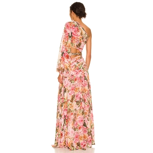 Macro shot of floral print chiffon dress with cutout waist and gold chain detail