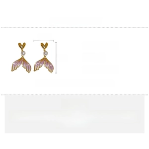 Detail showing mermaid tail earrings size of 2.5x4cm made of copper and pearl