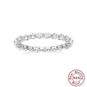 Close-up of a 925 sterling silver wedding band set with round diamonds on white background