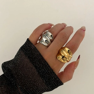 Polished gold and silver stainless steel rings with minimalist wavy ripple design