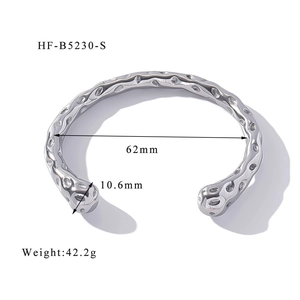Detail of silver textured irregular lava cuff bracelet showing 62mm diameter and dimensions