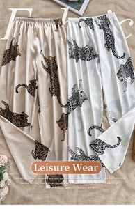 Detail of loose leopard print ice silk lounge pants with elastic waist and satin texture