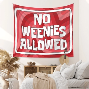 Detail of red spiral tapestry with NO WEENIES ALLOWED text hanging over a bed in a bedroom