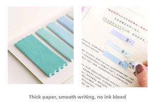 Macro detail of wave-edge index sticky notes showing smooth writing and thick paper