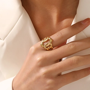 Chic 18K gold plated oval hollow geometric stainless steel ring on model's hand
