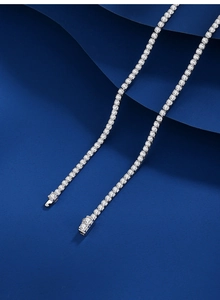 Macro shot of 2mm silver tennis chain with brilliant white zircon stones in row