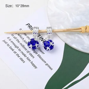 Detail of 10x28mm blue faceted crystal heart pendants with silver metal frames