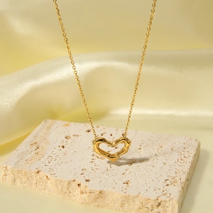 Irregular hollow heart pendant necklace in 18k gold plated stainless steel on stone
