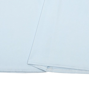 Close-up of light blue lace fabric texture with neat double-needle stitching details