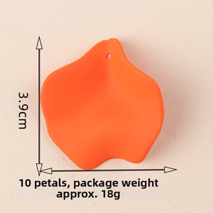 Macro shot of 3.9x3.5cm orange acrylic flower petal component for DIY jewelry crafting
