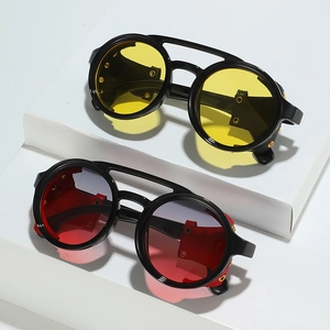 Retro round steampunk sunglasses with leather side shields on white geometric display