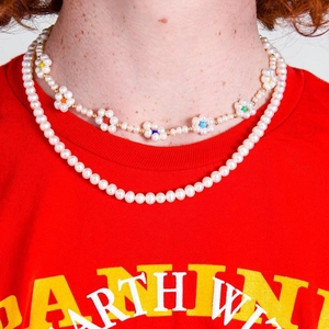 Baroque pearl choker necklace set with colorful flower accents on a female model
