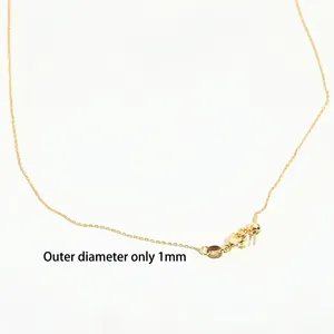 Detailed close-up of a 1mm gold adjustable O-chain necklace showing thin link texture