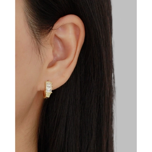 Elegant gold S925 silver hoop earrings with rectangular zircon stones worn by a model