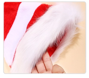 Macro view of plush white faux fur and red-white striped knit fabric of a Christmas hat