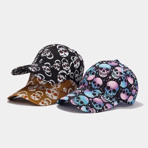 Detailed macro view showing diverse skull print colors and fabric textures on baseball caps