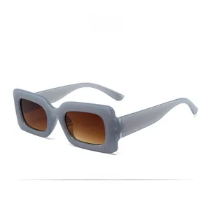 Detailed macro view of vintage rectangular sunglasses in light grey with brown gradient lenses