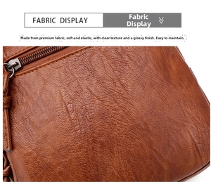 Detail of dark brown leather texture with metallic zipper and neat stitching on crossbody bag