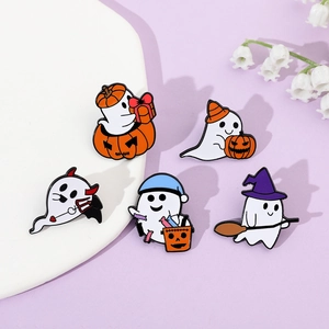 Detail view of five Halloween enamel pins featuring ghosts and pumpkins on purple background