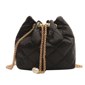 Mini black quilted bucket bag with gold chain drawstring and pearl accents for women