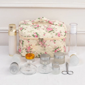 Quilted floral cotton cosmetic bag with top handle and double zipper for toiletries