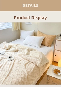 Close-up of beige fleece blanket featuring soft geometric textures and warm room decor