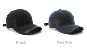 Close-up of vintage washed baseball caps in black and navy blue with distressed details