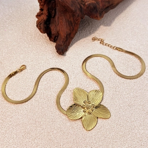 Vintage gold stainless steel floral necklace with textured flower pendant and snake chain