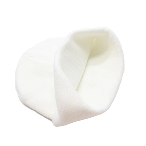 Close-up of a white knit beanie showing the fine stitch texture and minimalist rolled edge