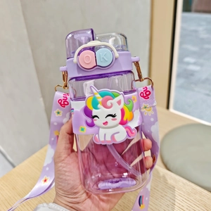 Close-up of a purple cartoon unicorn water bottle with a star pattern carrying strap