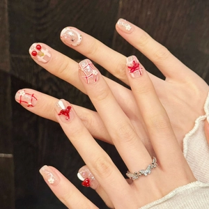 Handmade red press-on nails with 3D bows, pearls and cherry patterns with silver ring