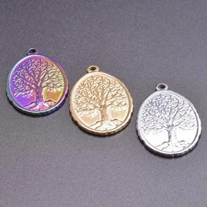 Detailed relief of Tree of Life oval pendants in rainbow, gold and silver finishes