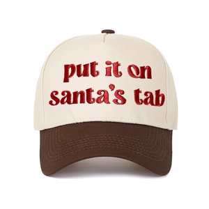 Close-up of red 3D embroidery showing Put It on Santa's Tab text on baseball cap