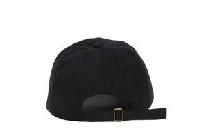 Detail of black cotton baseball cap back with adjustable strap and gold metal buckle