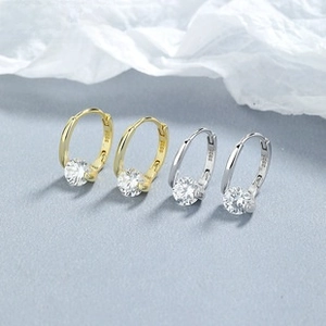 Close-up of S925 sterling silver hoop earrings with sparkling zircon and hallmark detail